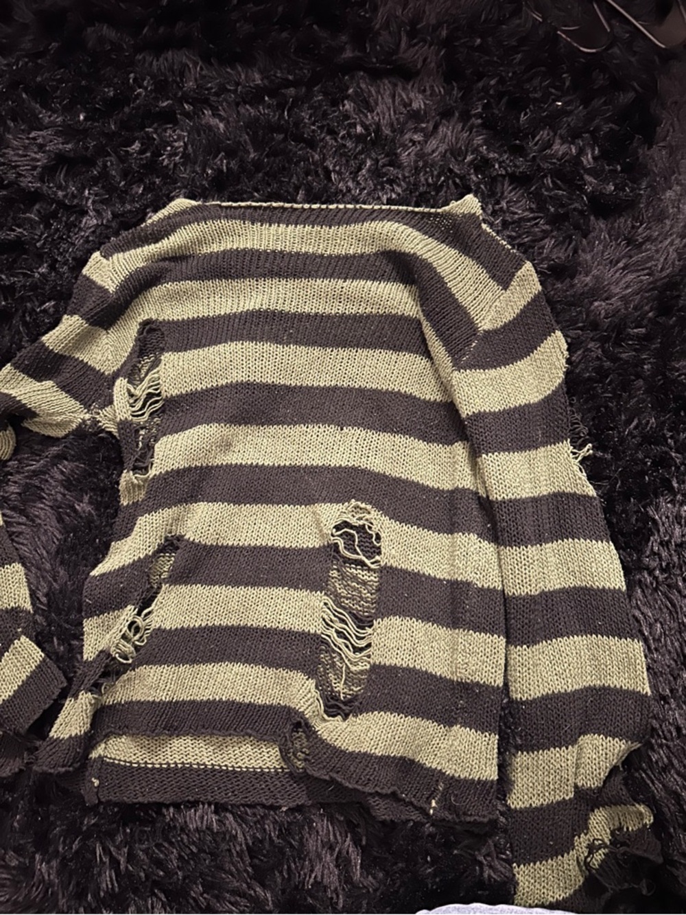 Distressed knitted sweater